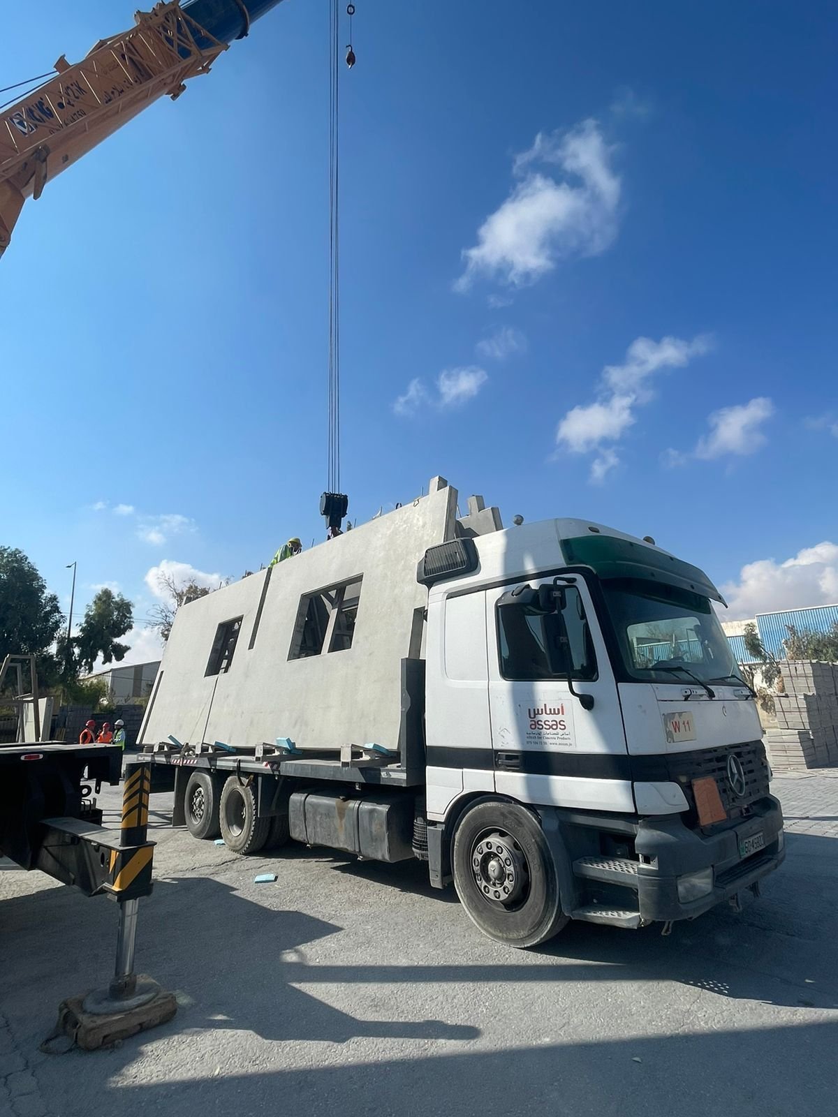 Precast unit transported by truck
