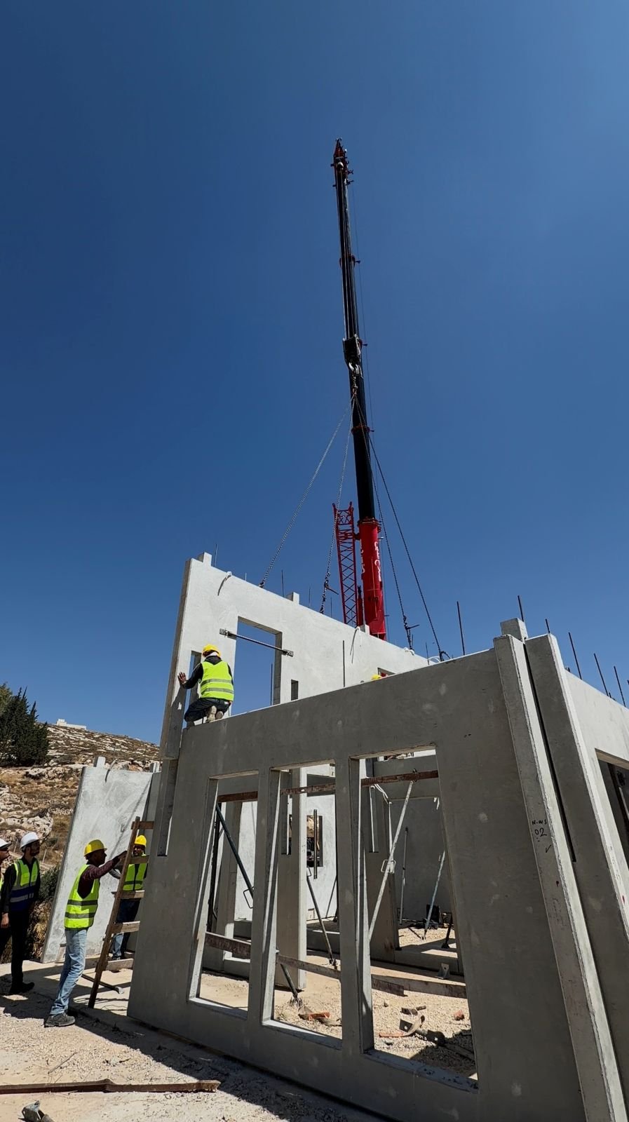 Panel lifted by crane