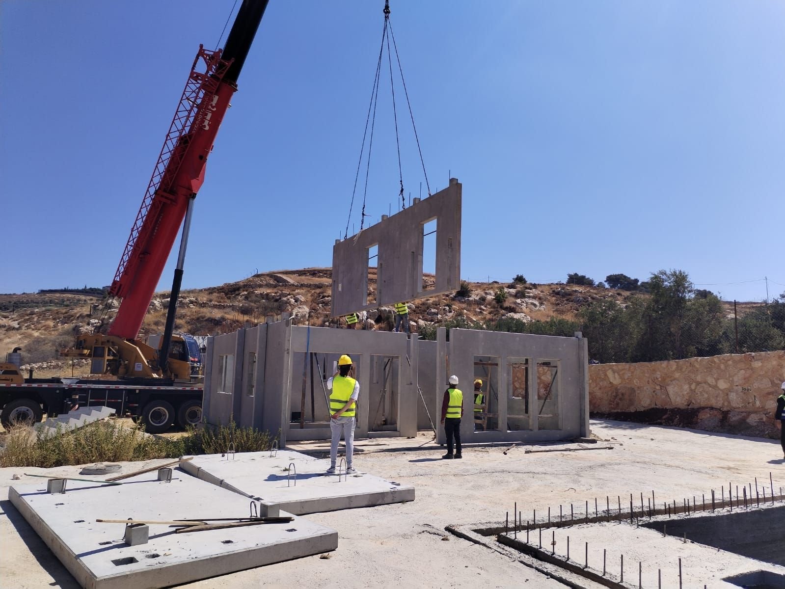 Crane installing panels